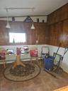 Dining space featuring wooden walls and a baseboard heating unit