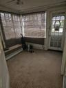 Unfurnished sunroom with a baseboard radiator