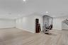 Basement Exercise area featuring recessed lighting, light wood-style flooring, and crown molding
