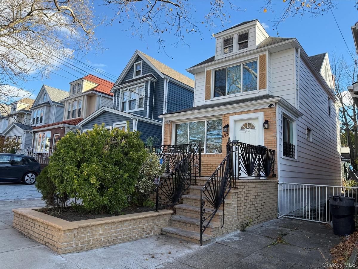View of front of house with brick siding