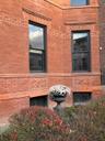 View of side of property featuring brick siding