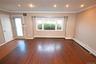 Spare room featuring crown molding, dark wood-style flooring, recessed lighting, and a baseboard heating unit