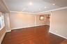 Spare room featuring ornamental molding, recessed lighting, dark wood-type flooring, a chandelier, and baseboard heating
