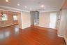Unfurnished room with ornamental molding, a wall mounted AC, recessed lighting, dark wood-style floors, and baseboard heating