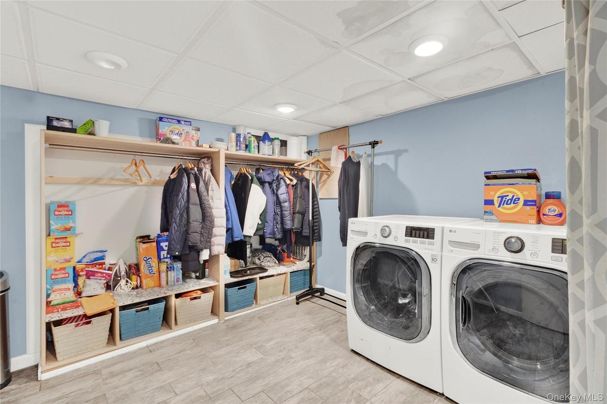 Laundry room featuring washer and clothes dryer