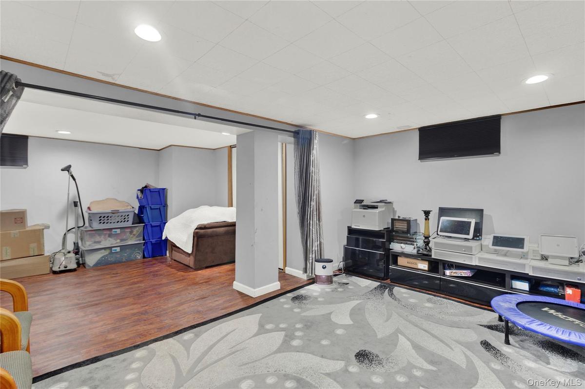 Bedroom featuring wood finished floors and recessed lighting