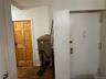 Corridor featuring dark wood-style flooring