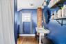 Full bath featuring lofted ceiling, dark wood-type flooring, and a shower with shower curtain