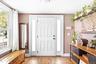 Foyer with wood finished floors and baseboards