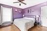 Bedroom featuring ceiling fan and wood finished floors