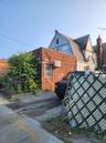 View of property exterior featuring brick siding