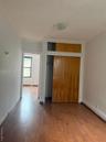 Unfurnished bedroom with a closet and wood finished floors