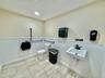 Half bathroom featuring a wainscoted wall and recessed lighting