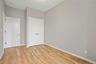 Unfurnished bedroom featuring a closet and light wood-style flooring