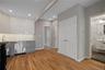 Kitchen featuring white cabinetry, gray cabinetry, tasteful backsplash, gas range oven, and recessed lighting
