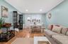 Living area featuring light wood-style flooring, recessed lighting, ornamental molding, and radiator