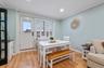 Dining room featuring crown molding, light wood-style flooring, and recessed lighting