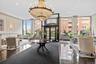 Building lobby featuring a decorative wall and recessed lighting