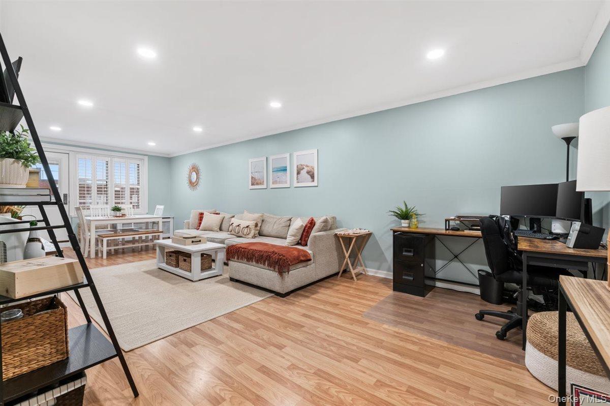 Office area featuring recessed lighting, ornamental molding, and light wood finished floors
