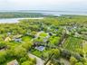 View of property location with property parcel outlined and a large body of water