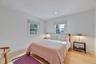 Bedroom with wood finished floors and recessed lighting