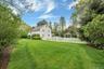 View of yard with view of wooded area