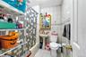 Full bath featuring tile walls, shower / tub combo, and tile patterned flooring
