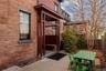 Doorway to property featuring brick siding