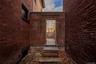 View of exterior entry with brick siding