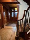 Foyer featuring light wood-type flooring and stairway