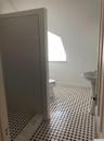Bathroom with toilet and a stall shower
