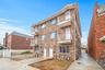 View of apartment building / complex with a garage