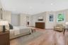 Virtually Staged Bedroom with light wood-style floors and recessed lighting
