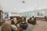 Virtually Staged Living room featuring light carpet, recessed lighting, french doors, and billiards