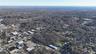 Aerial view of property's location with a forest