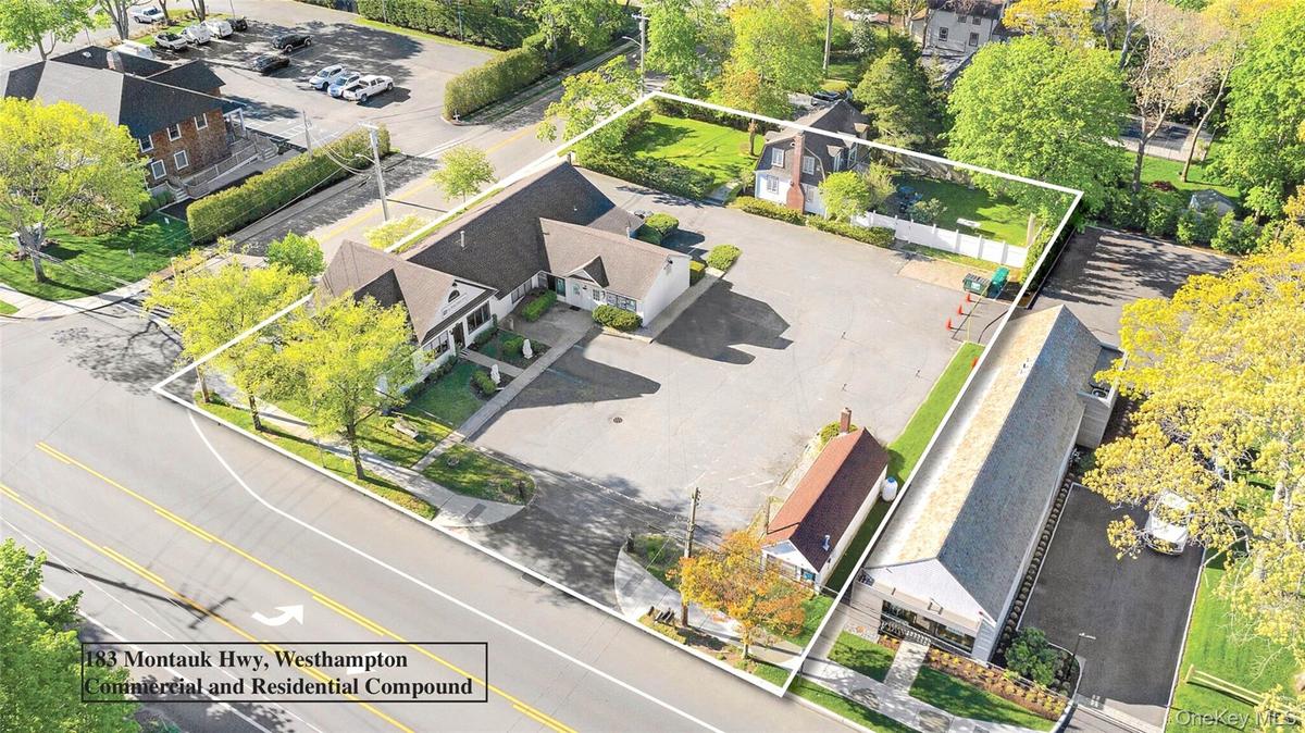 Aerial view of residential area with property parcel outlined