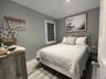 Bedroom featuring baseboards and light wood-style flooring