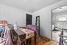 Dining space with light wood-style flooring and baseboards