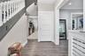 Entryway with recessed lighting, dark wood finished floors, and crown molding