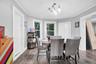 Dining space featuring dark wood-style floors and ornamental molding