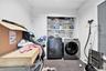 Laundry area featuring carpet and separate washer and dryer