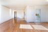 Empty room with light wood finished floors and crown molding