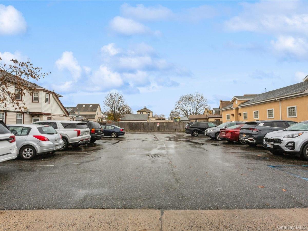 Uncovered parking lot with a residential view