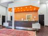 Reception area with recessed lighting, a towering ceiling, and ornamental molding