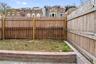 View of fenced backyard