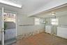Laundry room with ornamental molding and separate washer and dryer
