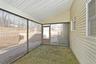 Unfurnished sunroom with lofted ceiling