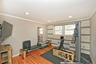 Exercise room featuring wooden walls, radiator heating unit, crown molding, wood finished floors, and recessed lighting