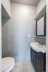 Bathroom with vanity and light tile patterned floors