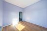 Empty room featuring arched walkways and hardwood / wood-style flooring